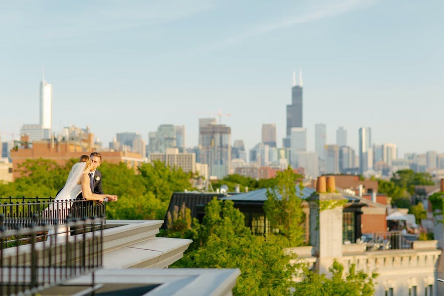 Intimate Summer rooftop micro wedding with Chicago skyline | PartySlate