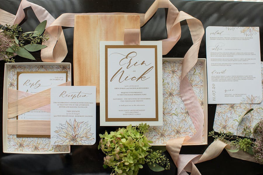 Micro wedding invitations with floral designs and ribbons | PartySlate