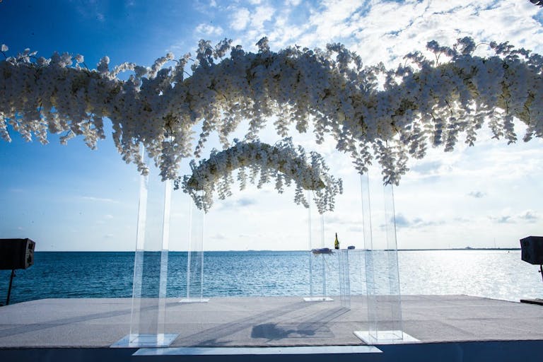 White floral seaside beach wedding | PartySlate