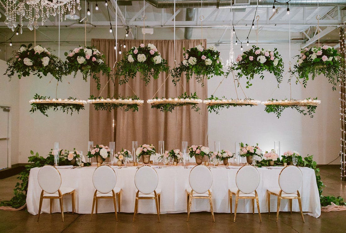 Garden themed micro wedding with so many hanging florals | PartySlate