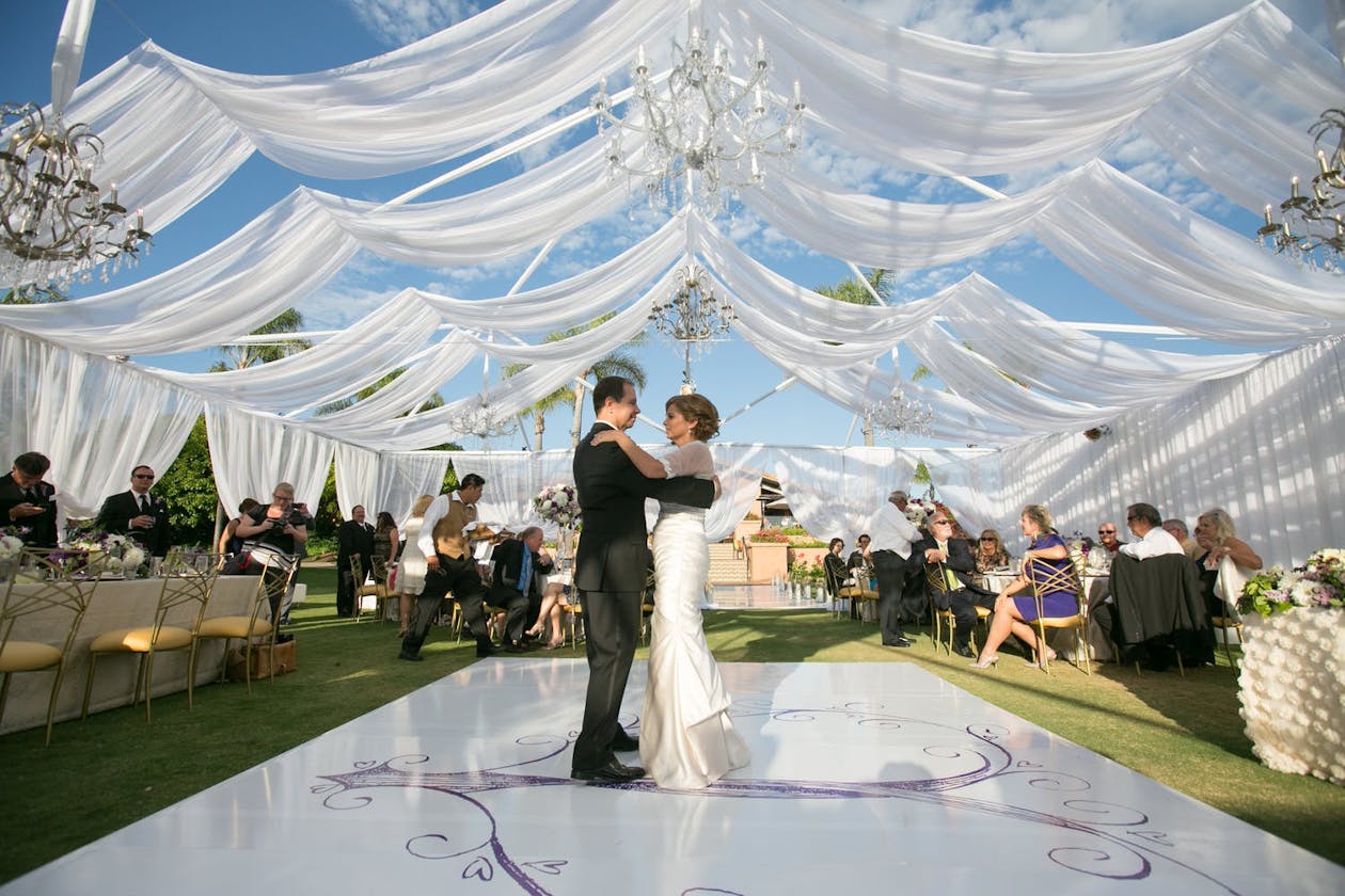 Tent Wedding With Ethereal White Drapery and Wisps of Blue Sky Peeking Through | PartySlate