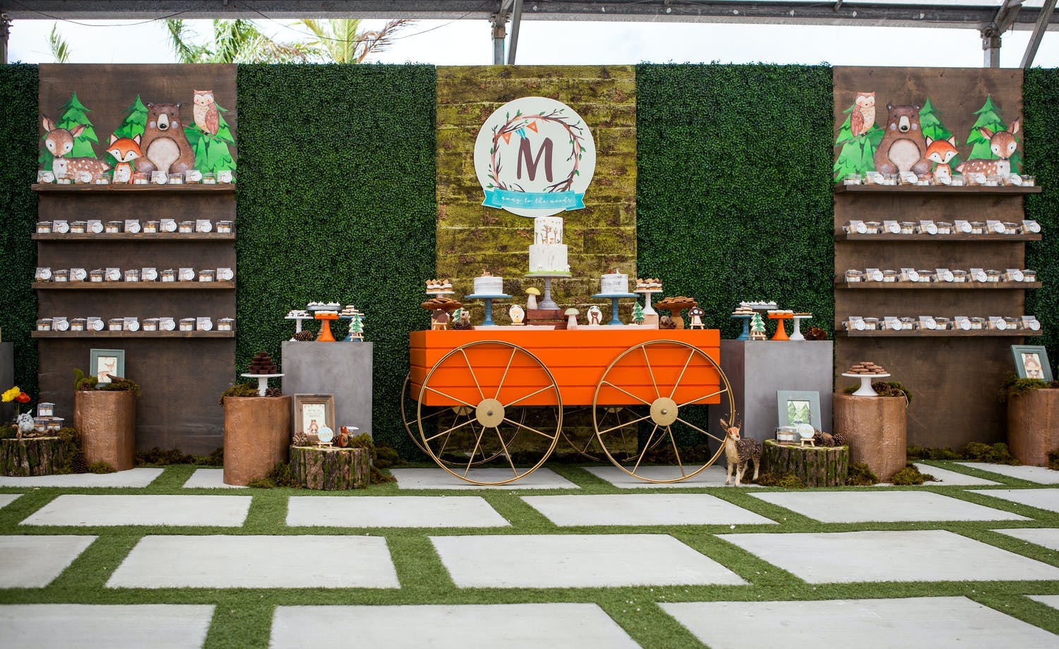 Forest-Themed Baby Shower With Boxwood Backdrop and Orange Wagon Dessert Station | PartySlate
