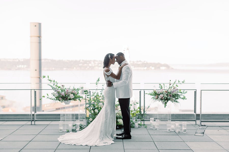 Rooftop view with glass candles and sophisticated florals | PartySlate