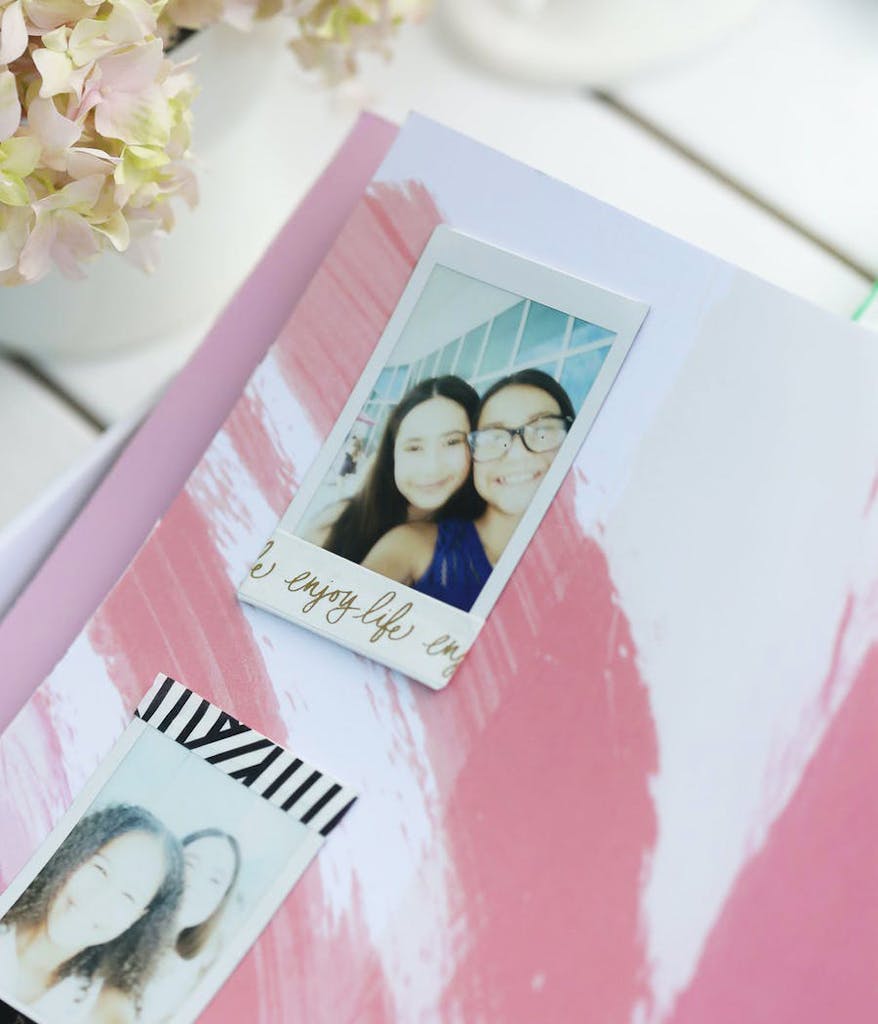 Selfies on top of a pink book from a pink Bat Mitzvah