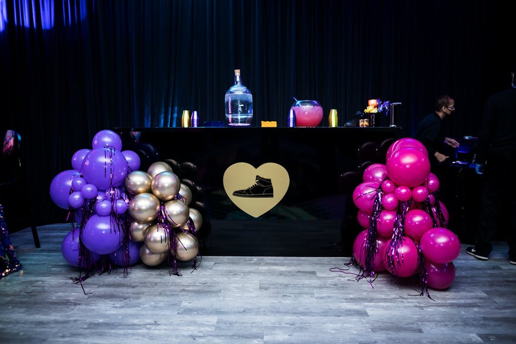 Sneaker-Themed Sweet 16 With Black Bar and Jewel-Toned Balloons | PartySlate