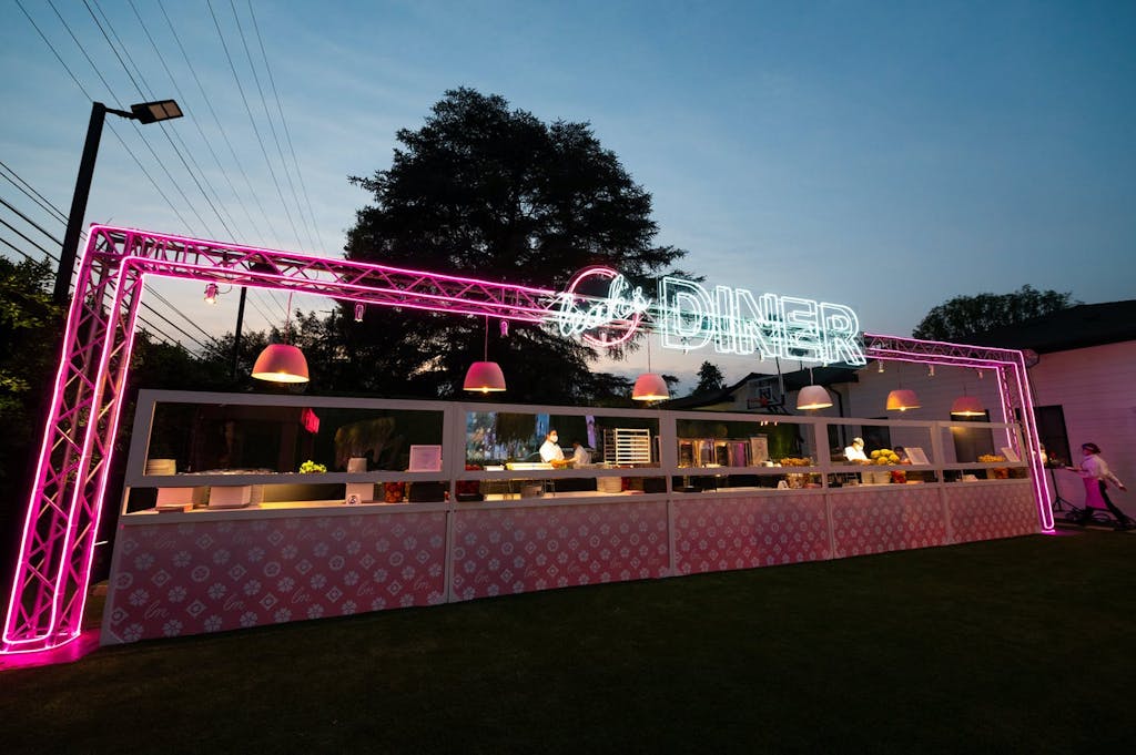 A buffet with LED/NEON "Diner" signage.