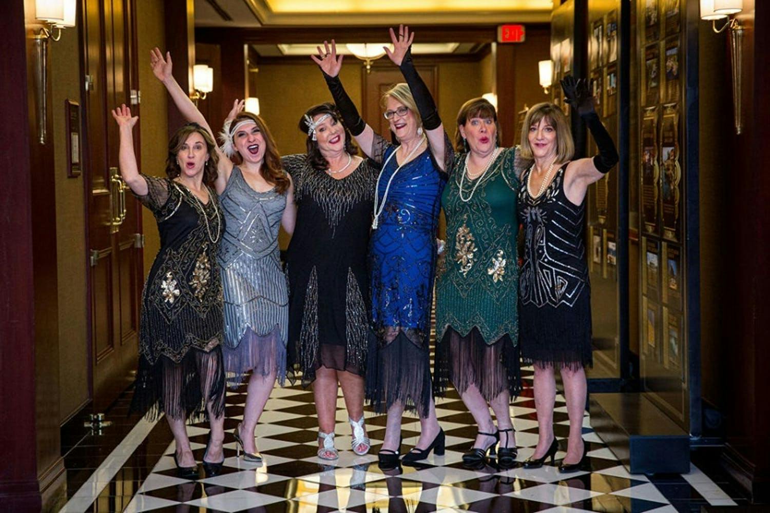 SIX GUESTS IN FLAPPER ATTIRE AT IMPACT MELANOMA'S SHADES OF HOPE GALA 2019 AT THE COLONNADE IN BOSTON, MASSACHUSETTS | PARTYSLATE
