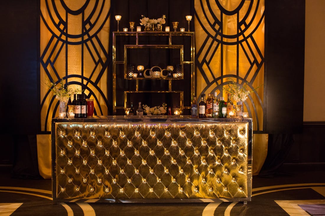 The Great Gatsby Party Themes Aren't Complete With out an Art Deco Gold Bar | PartySlate