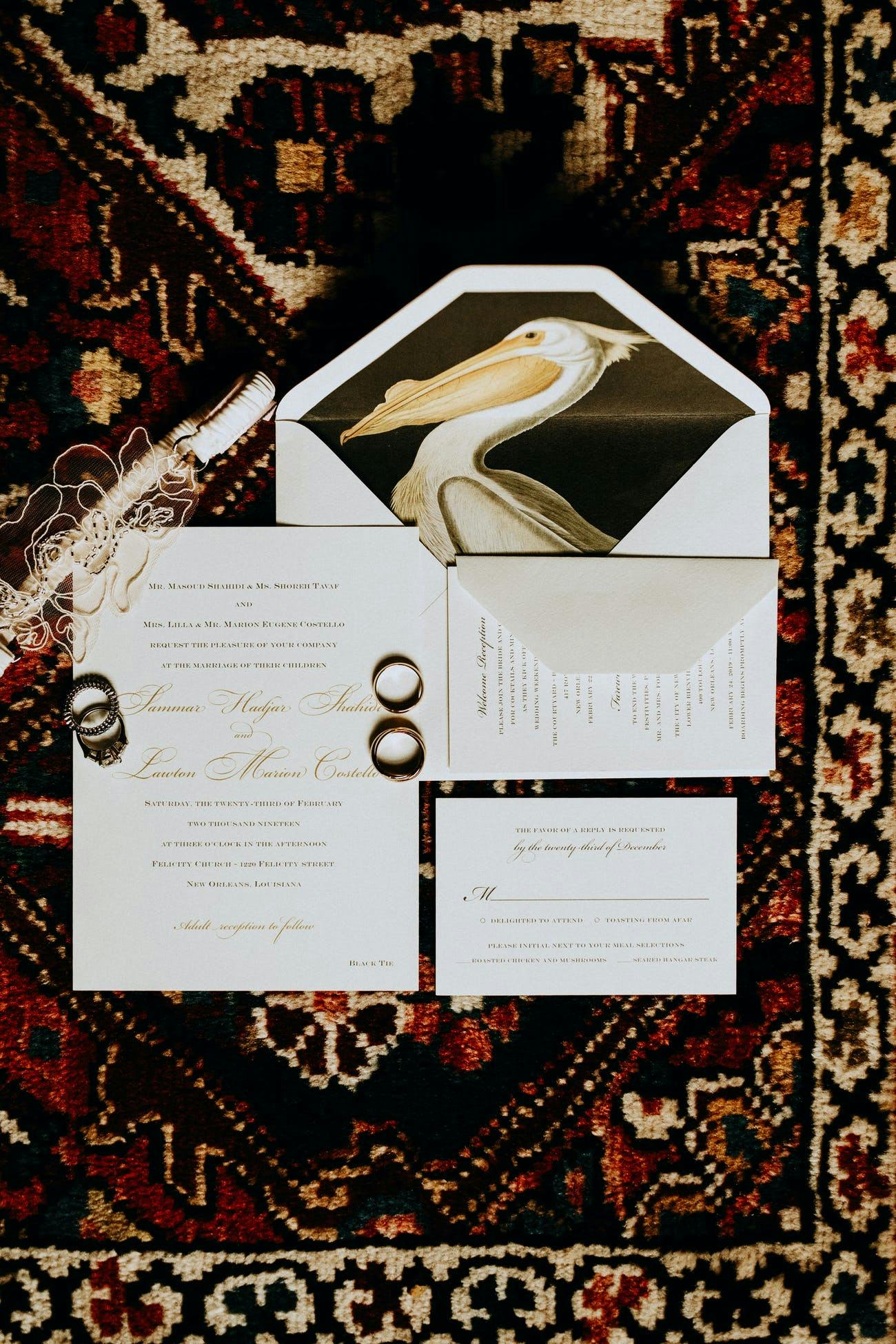 Wedding Invitation With Pelican Against Black Backdrop on Inner Envelope | PartySlate