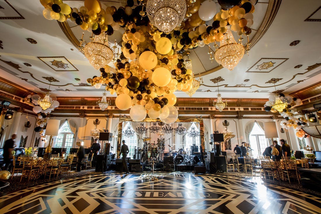 A Great-Gatsby Themed Party With Glitzy Chandeliers and a Black and Gold Balloon Installation | PartySlate