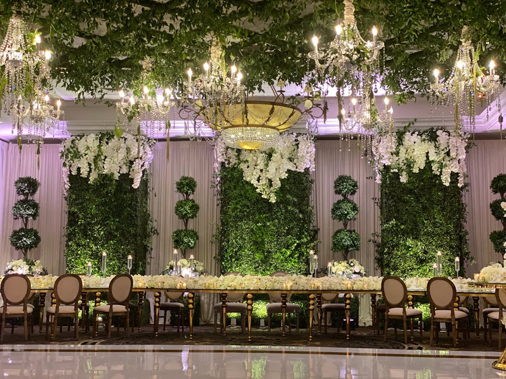 Ballroom Enchanted Forest Wedding With Glittering Chandeliers and Greenery | PartySlate