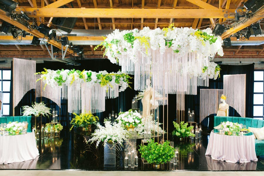 Great Gatsby Party With White and Green decor hanging from the ceiling | PartySlate