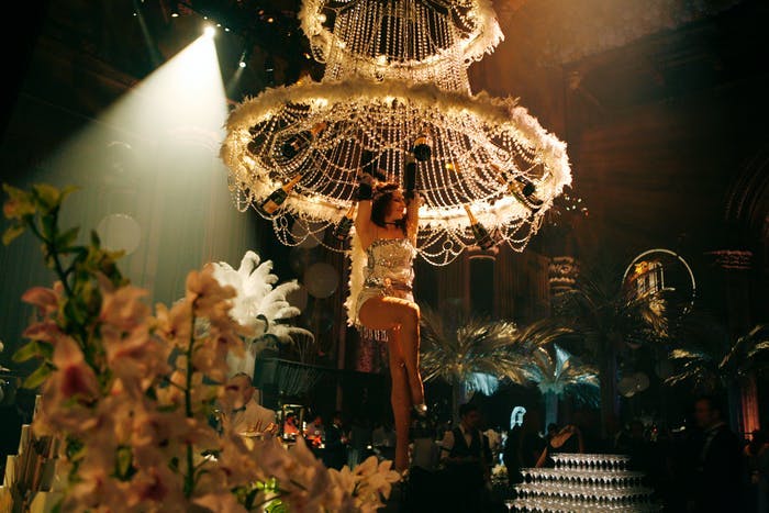 Gatsby Party With Entertaining Flappers Hanging From Feather Chandeliers | PartySlate