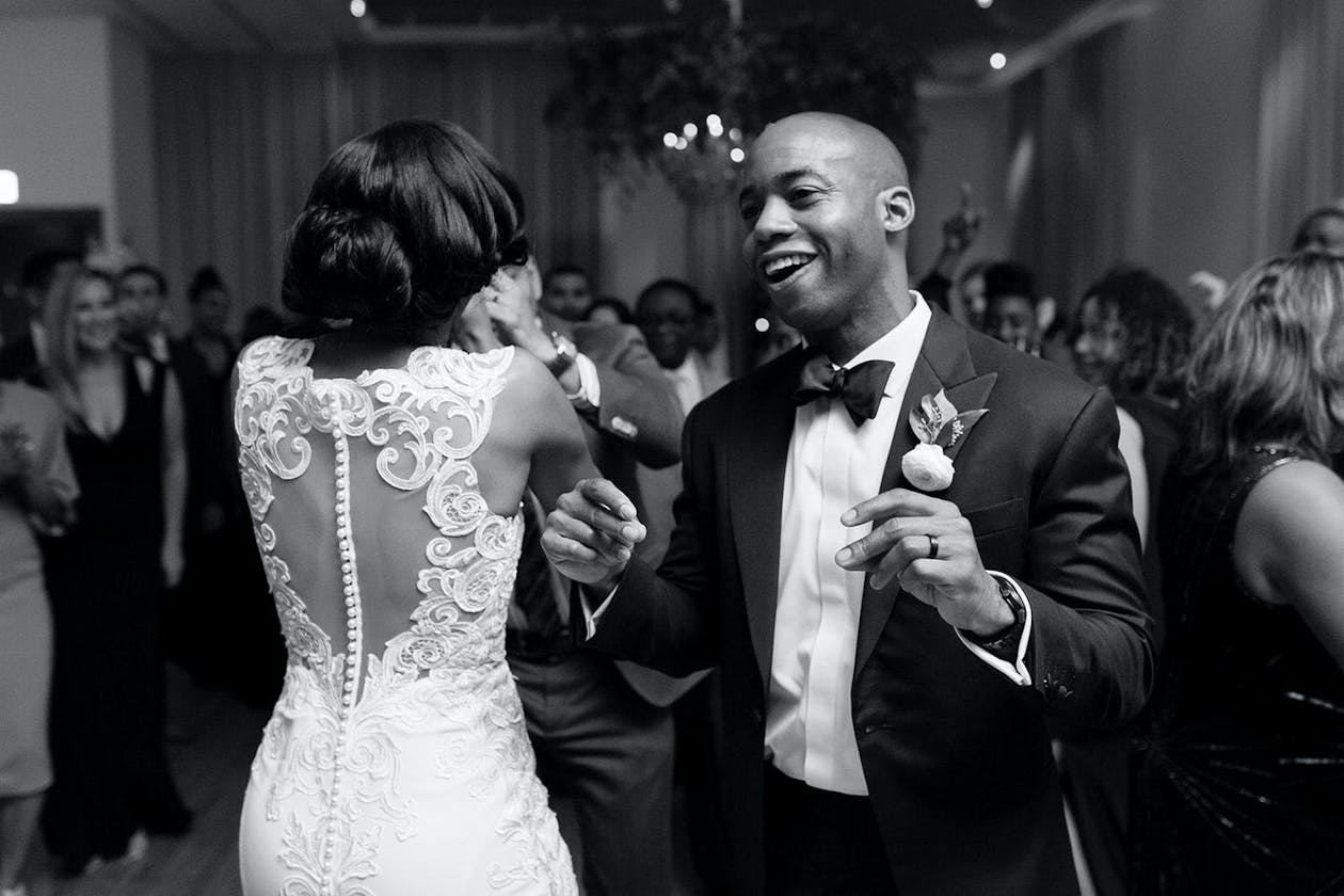 Black and White Wedding Photo of Couple Dancing by Chicago Photographer Emilia Jane Photography | PartySlate