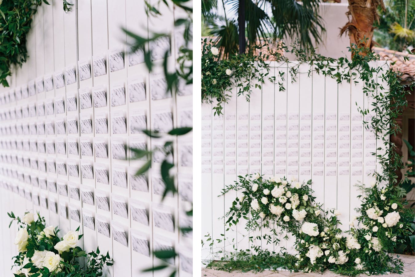 Marbled Escort Cards Attached To White Fence Backdrop With Greenery and White Flowers | PartySlate