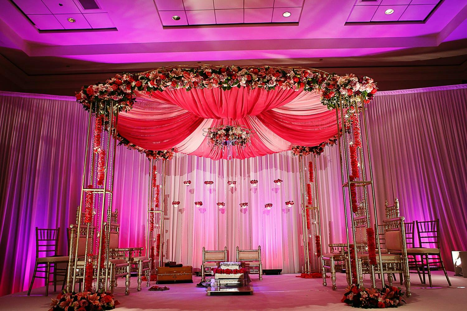 Mandap With Modern Brass and Red Carnation Tassels | PartySlate