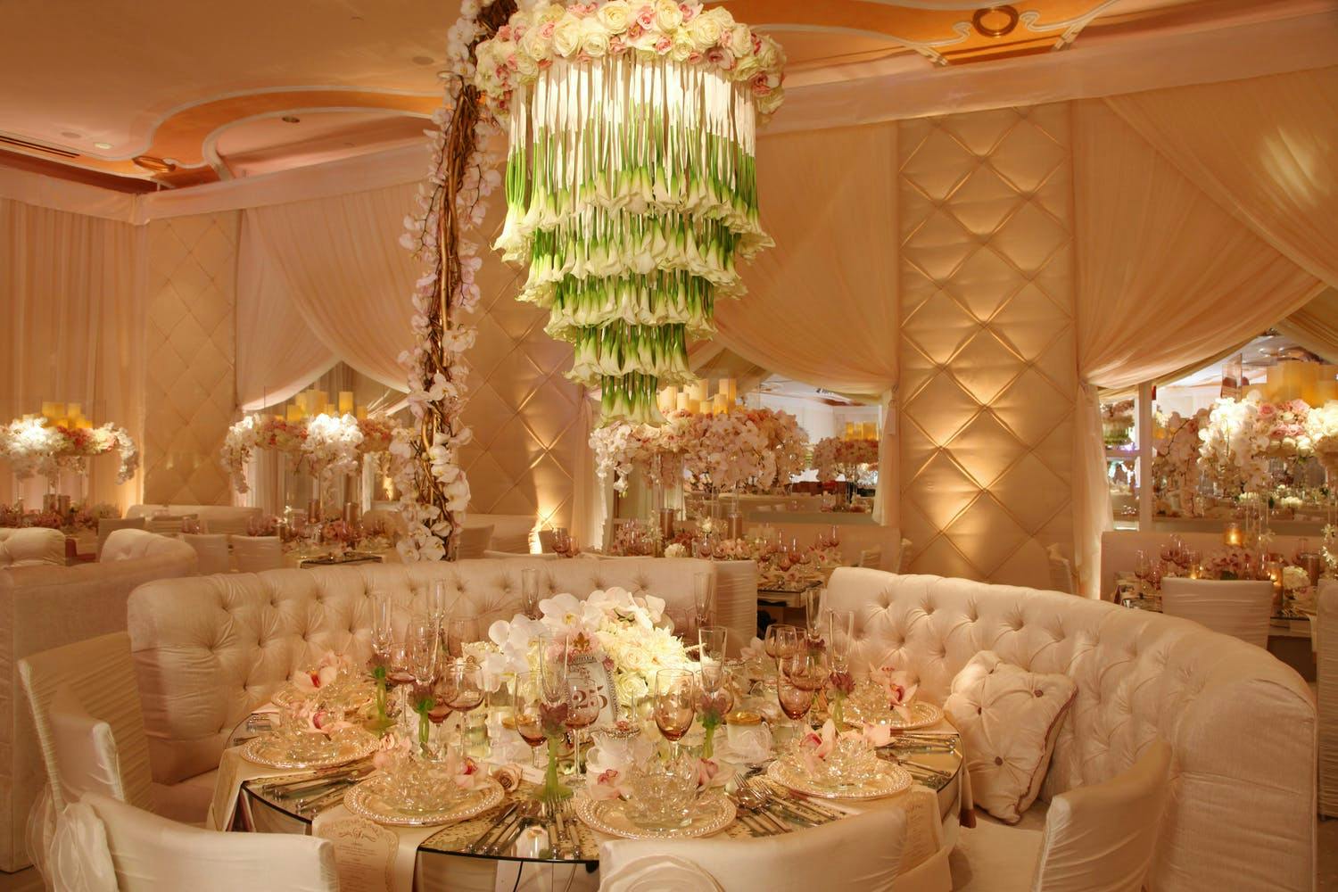 Ballroom Wedding in Peach Tones With Tulip Waterfall-Style Chandelier | PartySlate