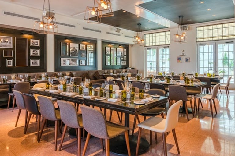 Private dining Miami is a must. Elongated tables, and natural light | PartySlate