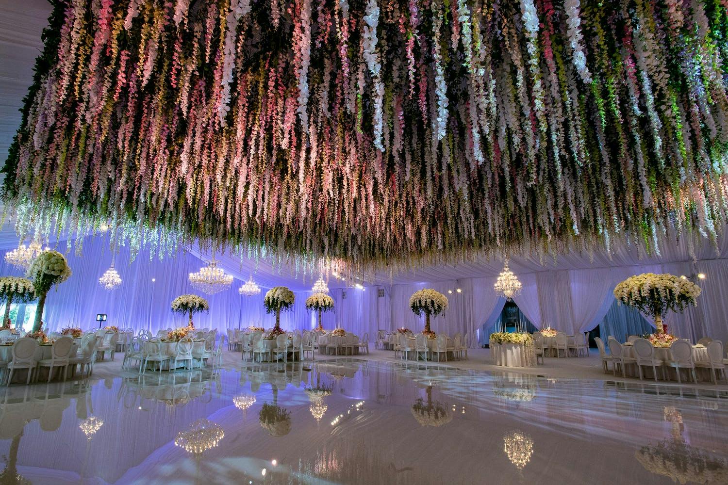 Wedding Ballroom With Mirrored Dance Floor and Floral Fringe Wedding Ceiling Decorations | PartySlate