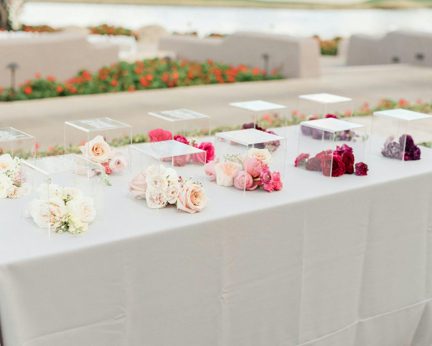 Lucite Boxes Inscribed With Wedding Table Numbers and Filled With Ombré-Hued Flowers | PartySlate