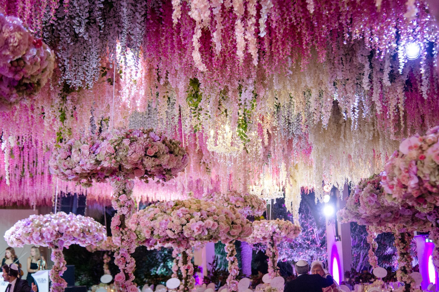 Wedding Reception With Lavish Floral-Fringe Ceiling Décor and Floral Parasol-Shaped Centerpieces | PartySlate