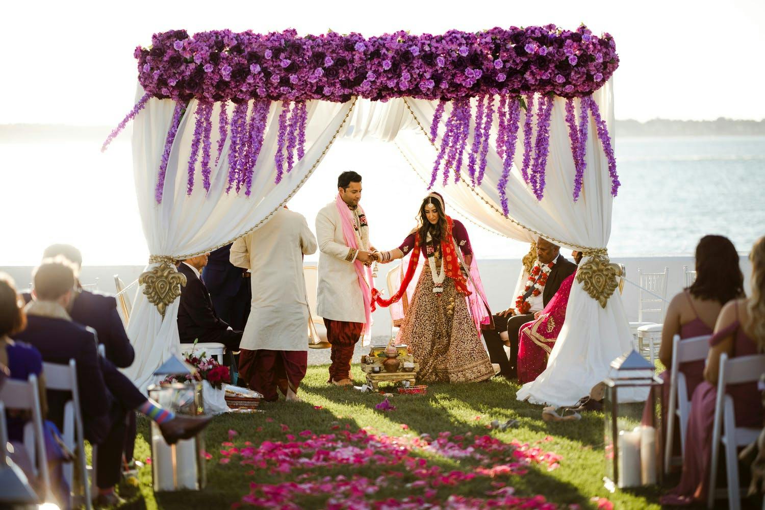 Mandap With Dreamy White Drapery and Windswept Purple Blooms | PartySlate