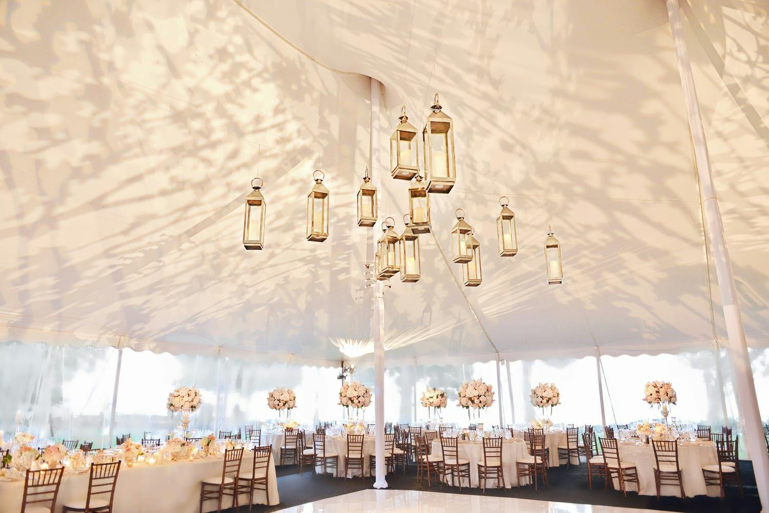 White Pole Tent With Lantern Wedding Ceiling Decorations and Dappled Treetop Lighting Projection | PartySlate
