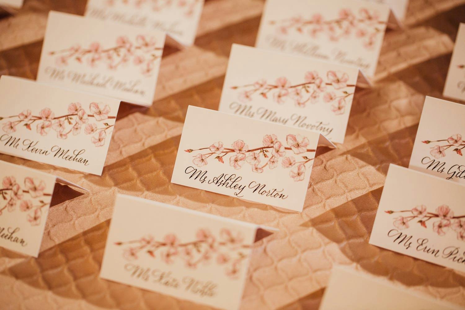 Wedding Escort Cards With Painted Cherry Blossom Designs | PartySlate