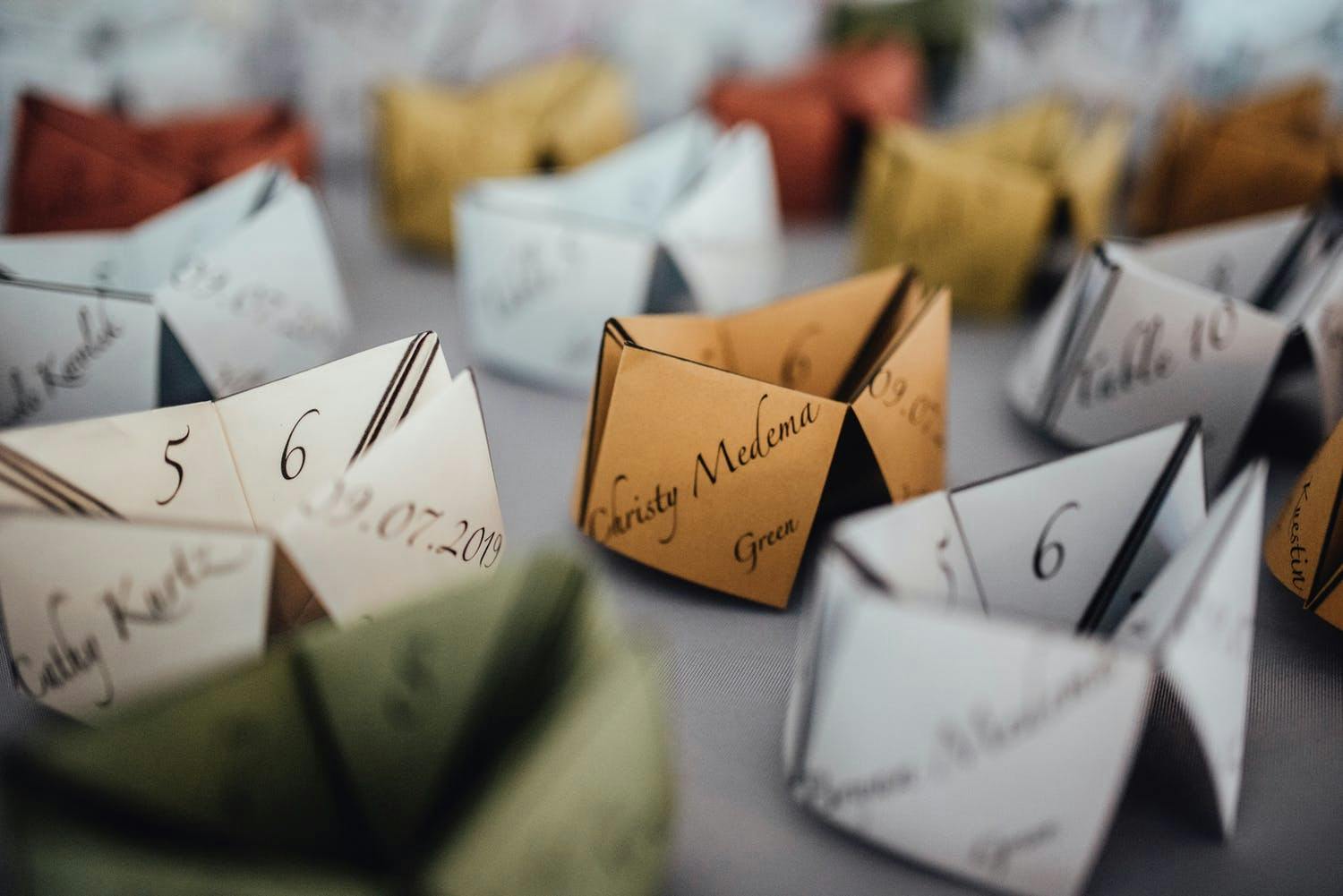 Red, Gold, Green, And Silver Origami-Inspired Fortune Teller Place Cards | PartySlate