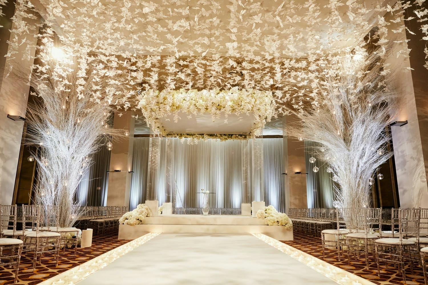 White Wedding Ceremony at The Standard Club With Butterfly Ceiling Installation | PartySlate
