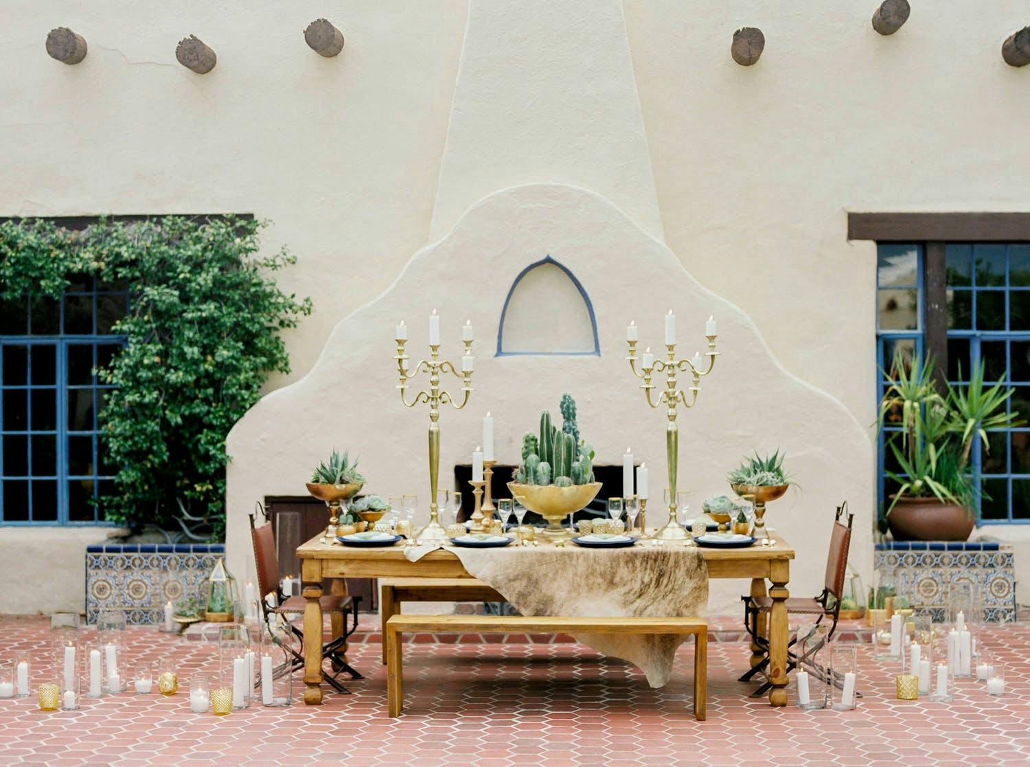 Dessert-Themed Wedding With Intimate Wedding Reception Table Laden Succulent Wedding Centerpieces and Golden Candelabras | PartySlate