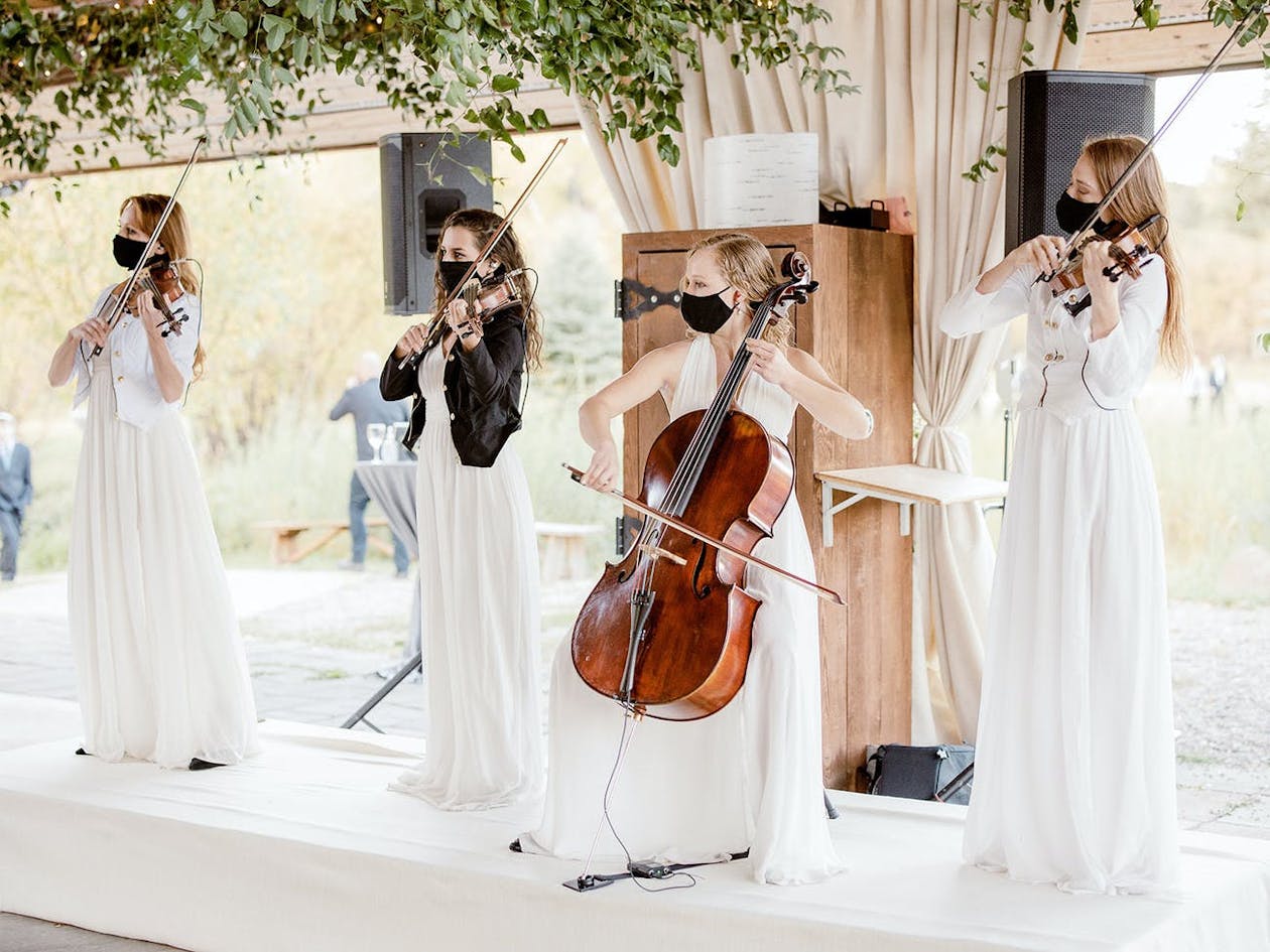 Orchestra at Wedding With White Gowns on | PartySlate