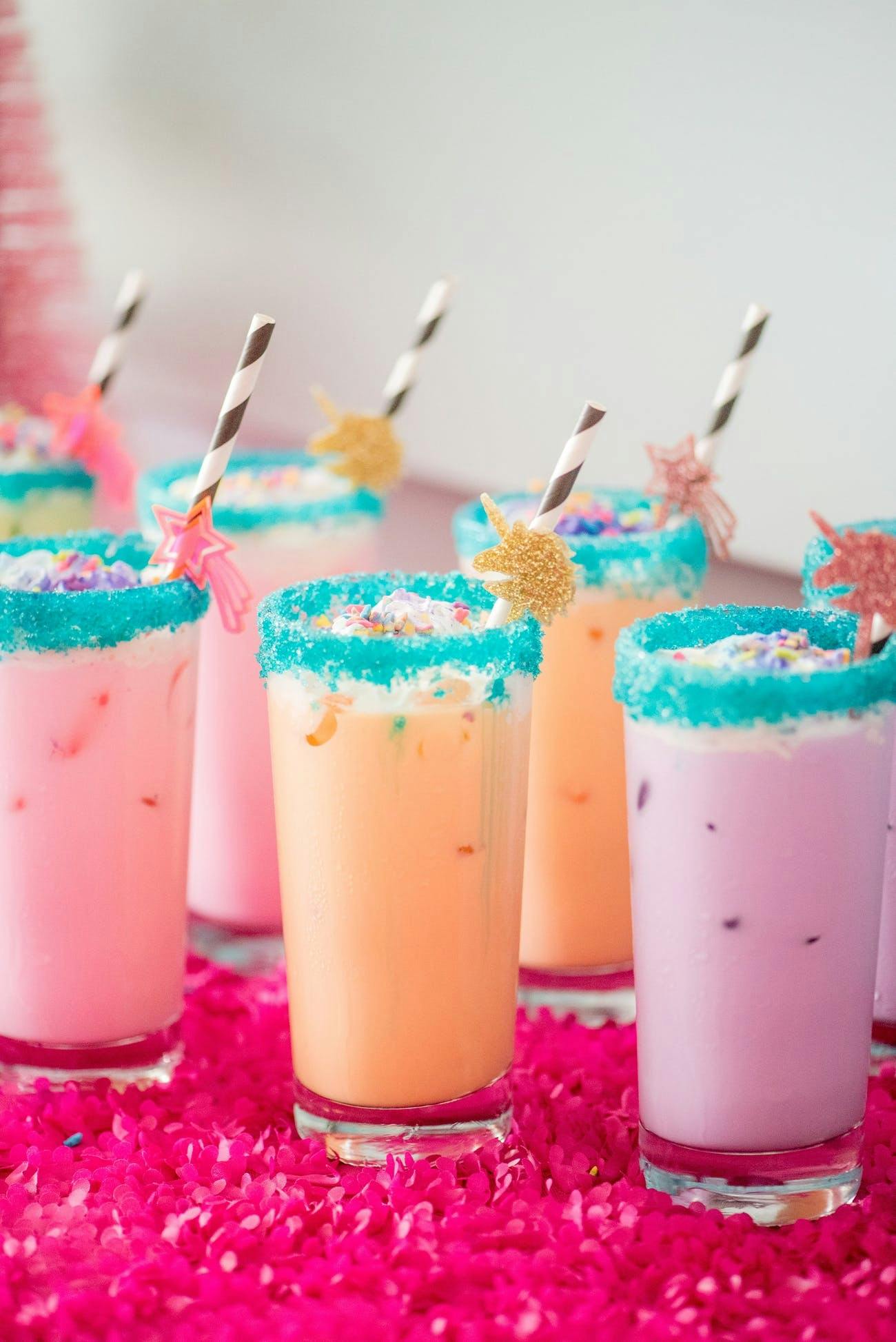 Purple and Orange colorful drinks at 90's themed party | PartySlate