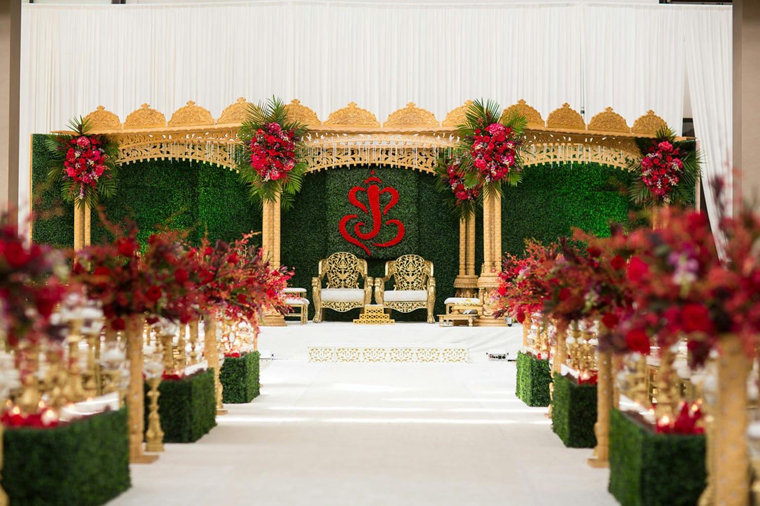 Mandap With Royal Gold Accents and Natural Greenery | PartySlate