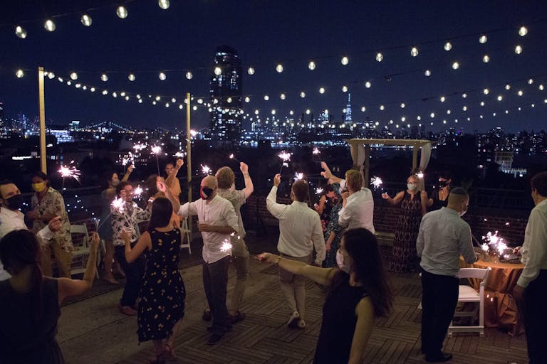 Rooftop Micro Wedding Dance Party With Fairy Lights at Night | PartySlate