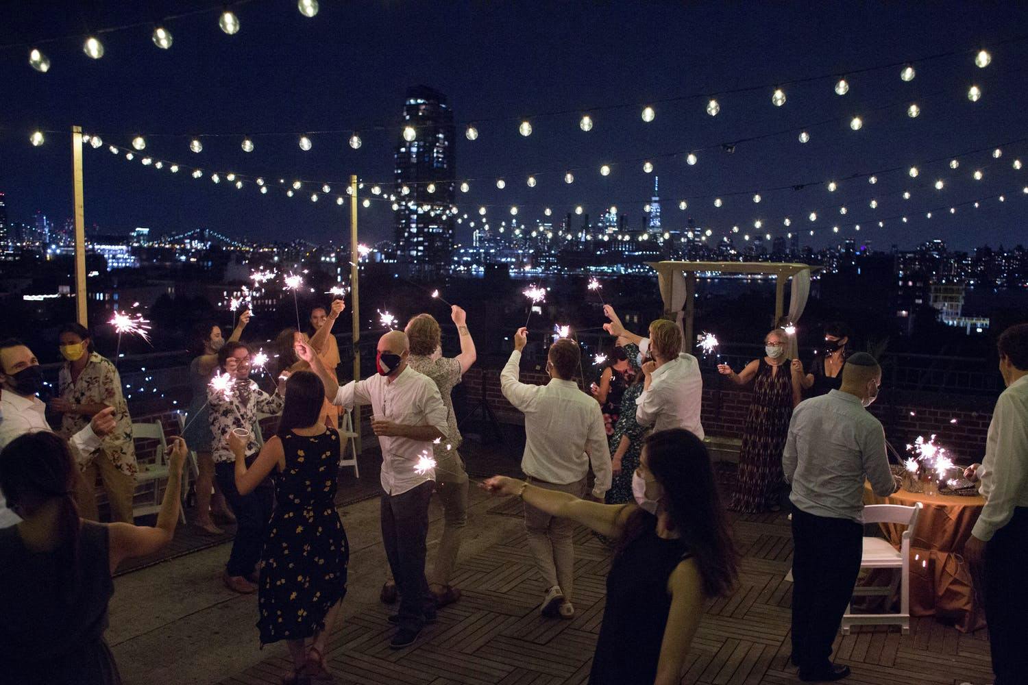 Rooftop Micro Wedding Dance Party With Fairy Lights at Night | PartySlate
