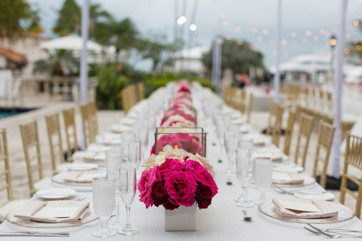 Mod-Beach Centerpiece With Pops of Pink and Sleek White Vases | PartySlate