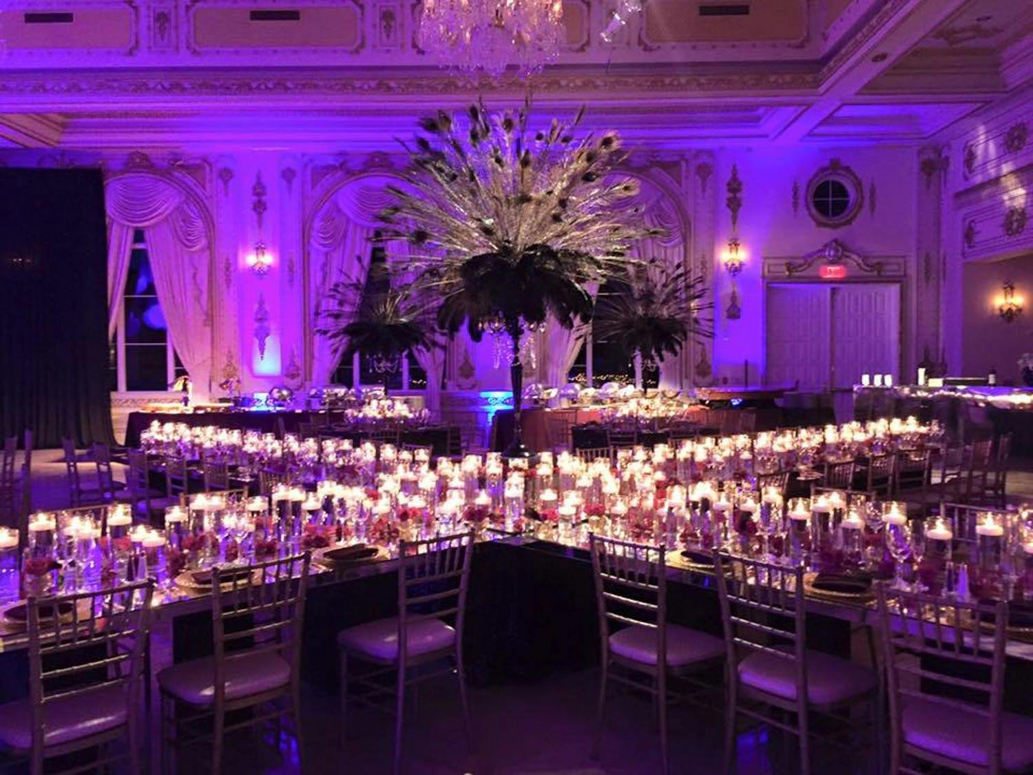 Wedding Ballroom With Mirrored Tables and Glittering Candle Centerpieces | PartySlate