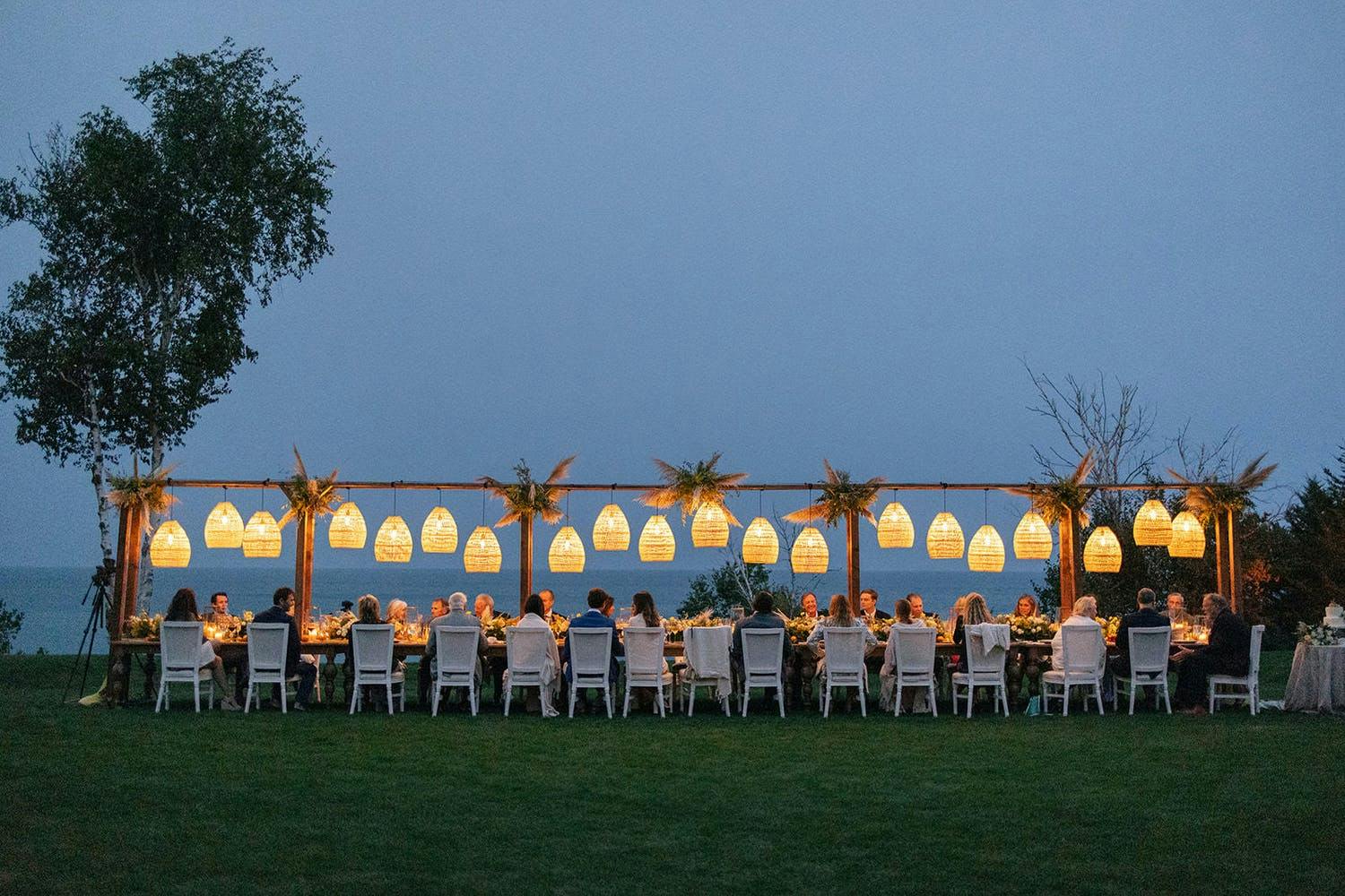 Elevated Boho-Beach Centerpiece With Candlelit Wicker Chandeliers | PartySlate