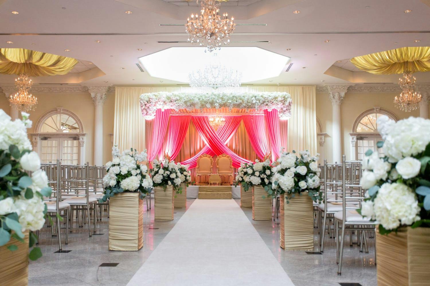 Mandap With Bright-Pink Drapery and Canopy of All-White Blooms | PartySlate