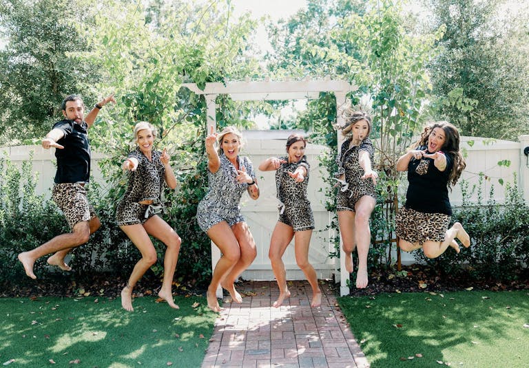 Two Brides and Friends Jump For Joy in Cat-Print PJs | PartySlate