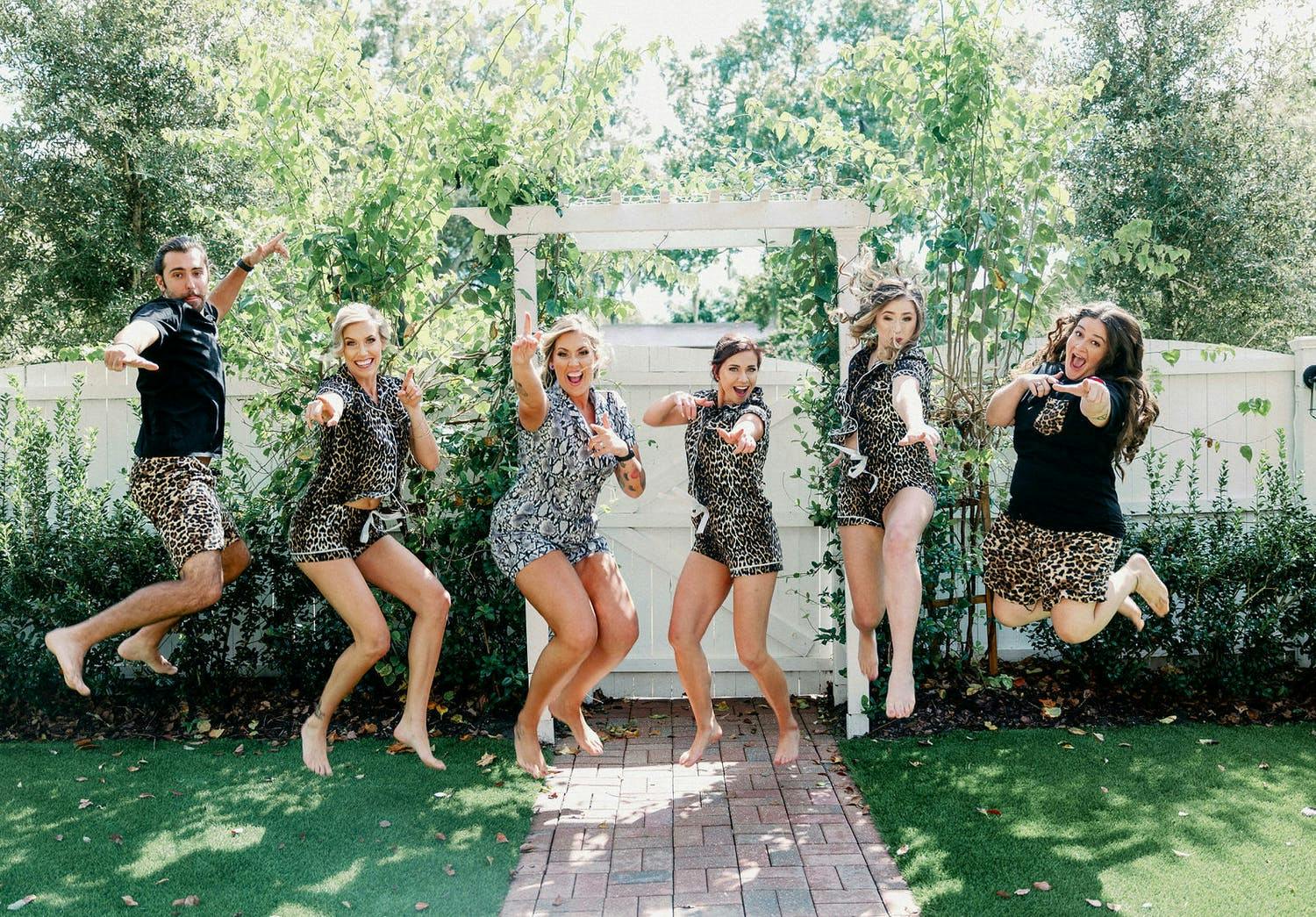 Two Brides and Friends Jump For Joy in Cat-Print PJs | PartySlate
