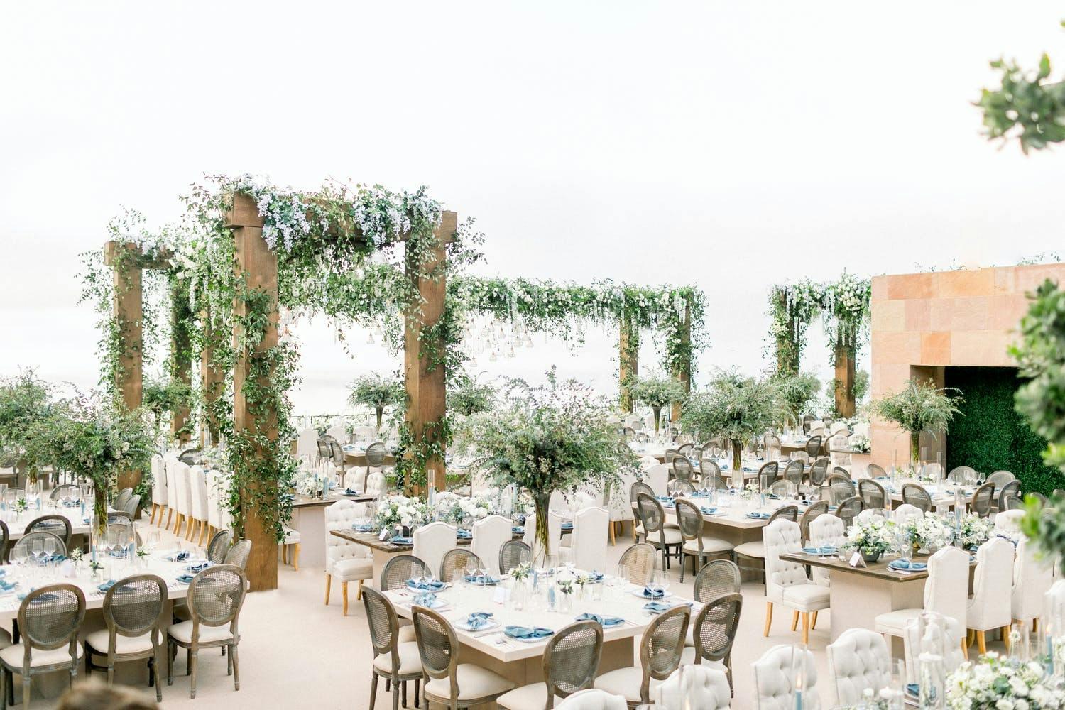 Tall Wedding Centerpiece of Loose, Organic Greenery | PartySlate