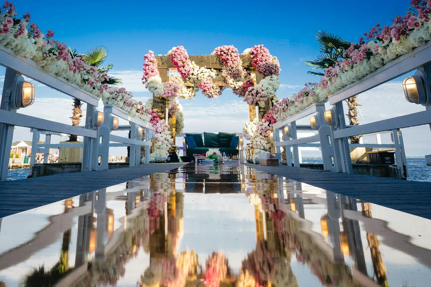 Mandap With Opulent Gold Design and Mirrored Wedding Aisle | PartySlate