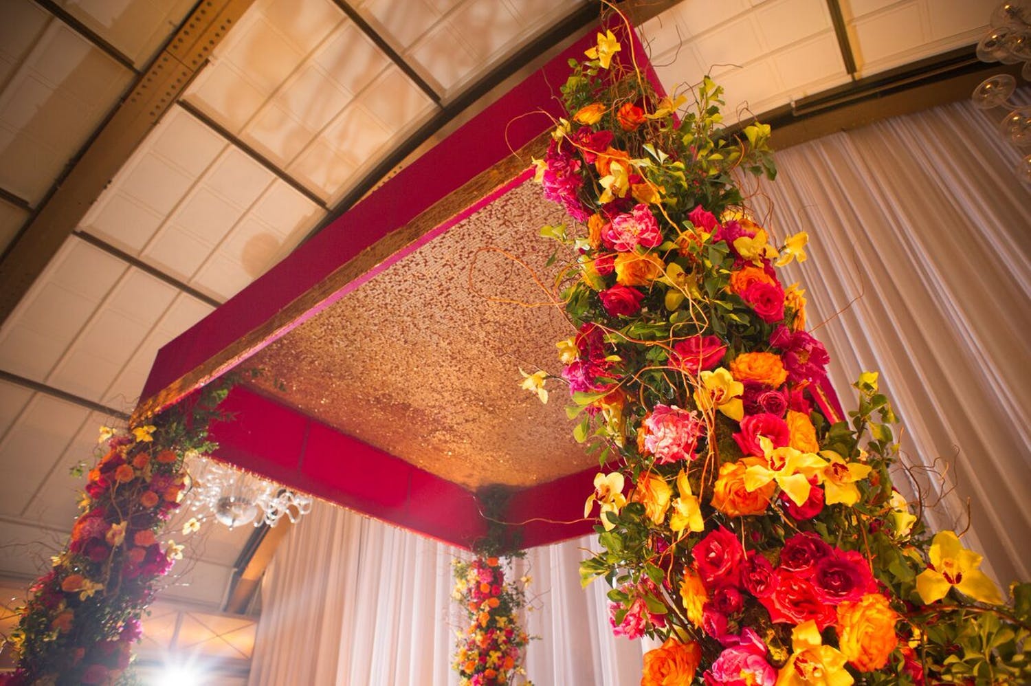 Mandap With Gold Sequins and Bright Bloom Structure | PartySlate