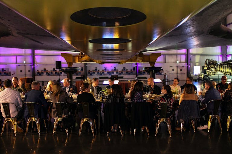 Intimate Dinner Party Under Wing of Shuttle at California Science Center in University Park, Los Angeles, CA | PartySlate