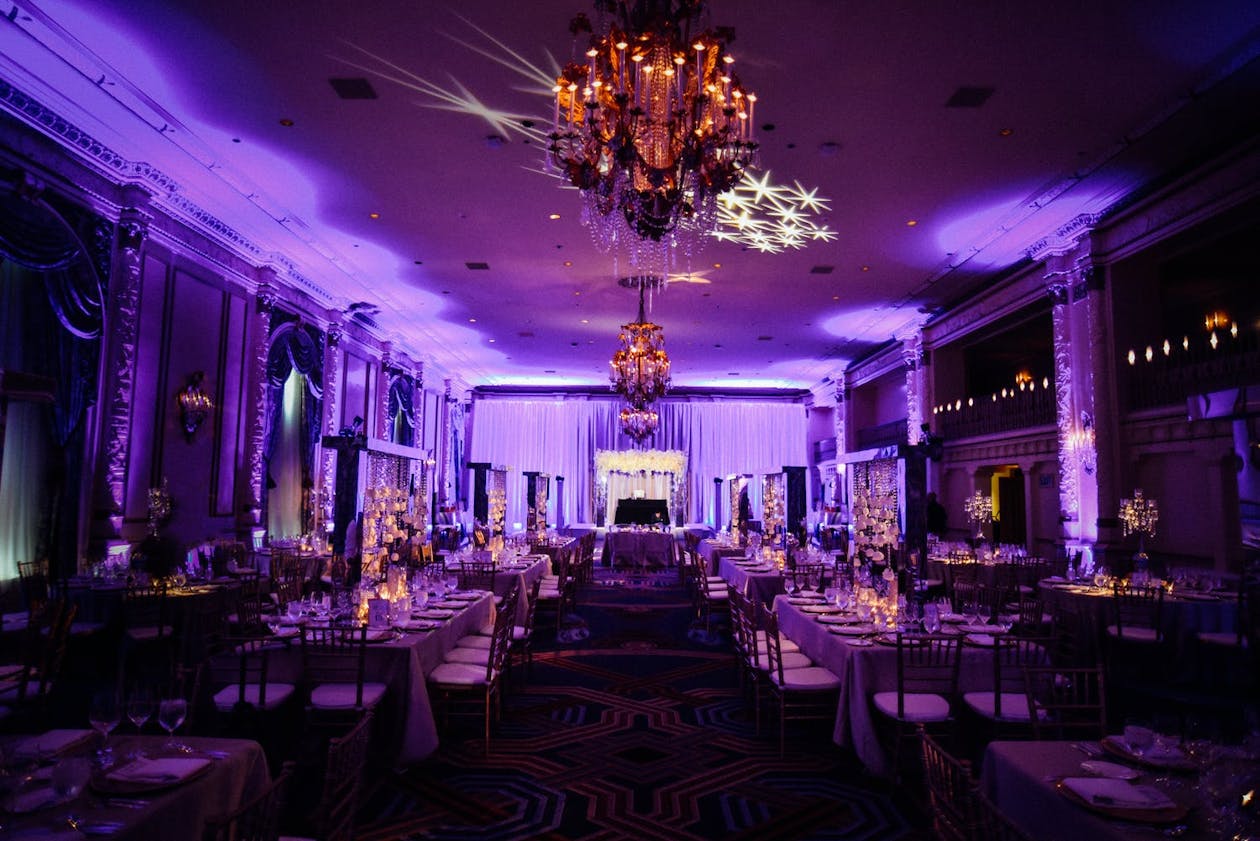 Purple Wedding Uplighting With Shooting Star Ceiling Gobo | PartySlate