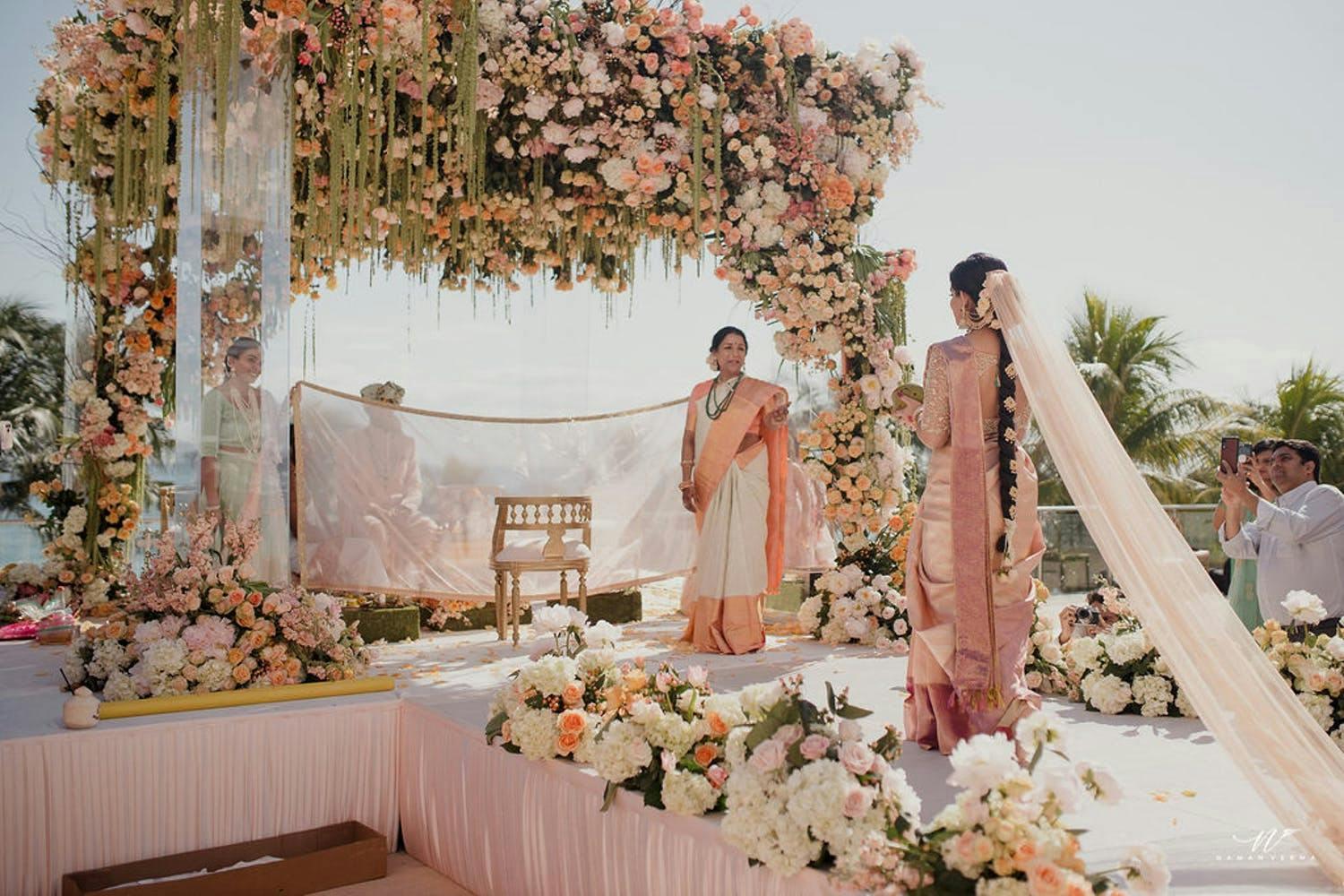 Mandap With Cascade of Soft Blooms and Tendrils of Greenery | PartySlate