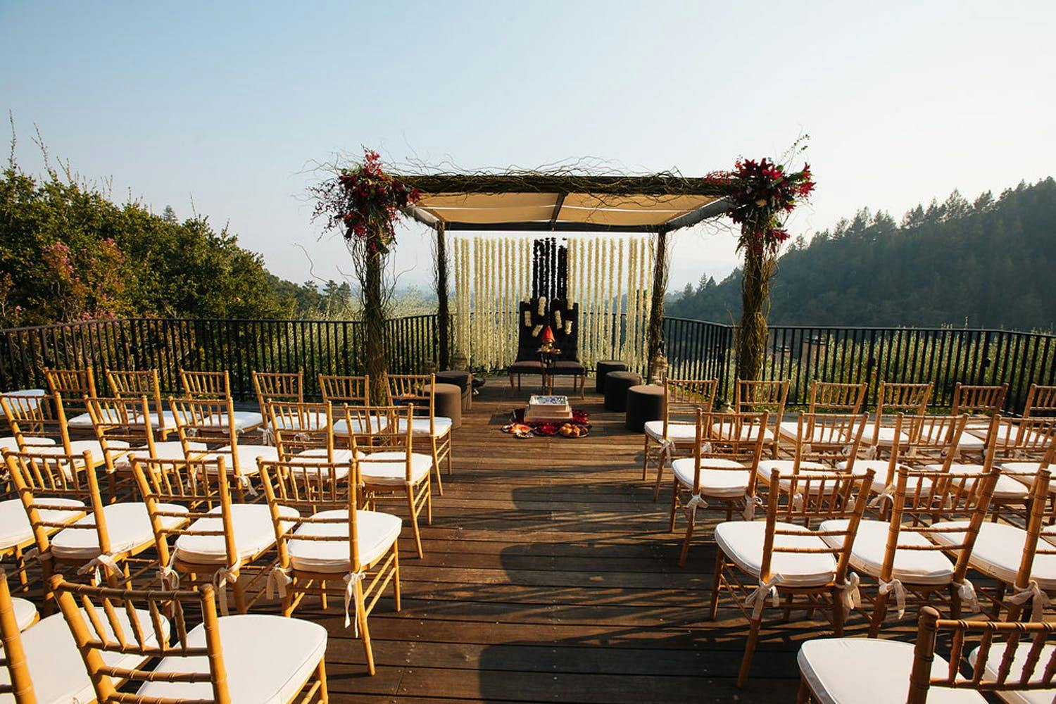 Mandap With Rustic-Glam Branches and Wild Red Blooms | PartySlate