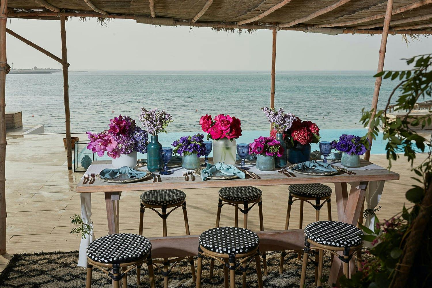 Beach-Style Wedding Tablescape of Pinks, Purples, and Blues | PartySlate